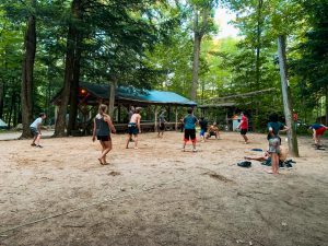 people playing volleyball at the forested Peshtigo Outpost campground