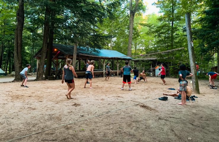 people playing volleyball at the forested Peshtigo Outpost campground
