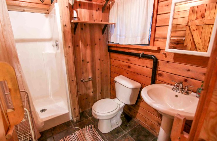 interior photo of Hideaway cabin bathroom with toilet and shower