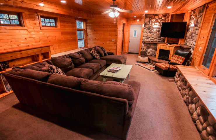 image of Peshtigo Lodge living room with couch and TV