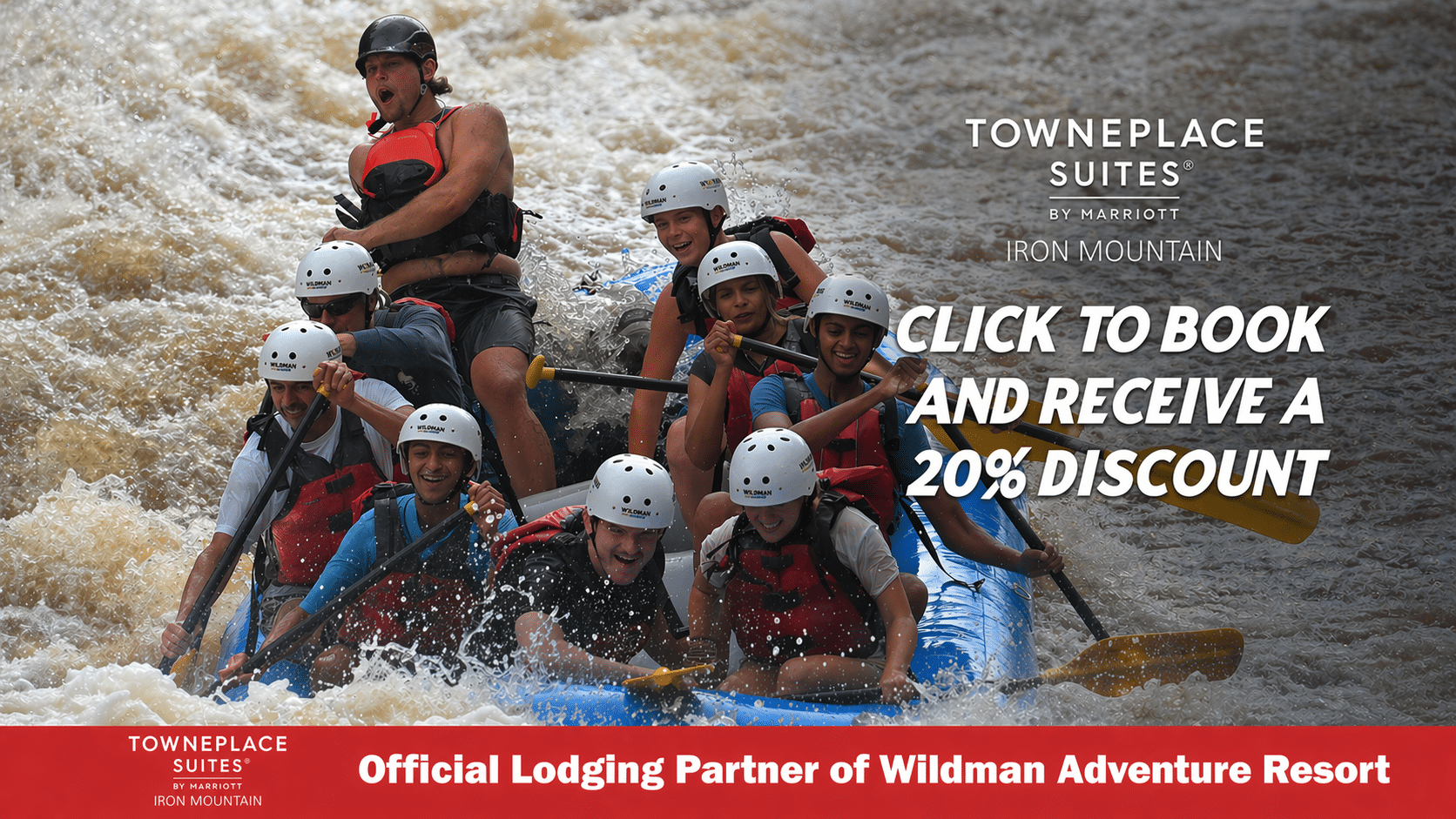 Group of people having a blast rafting the Menominee River at Wildman Adventure Resort