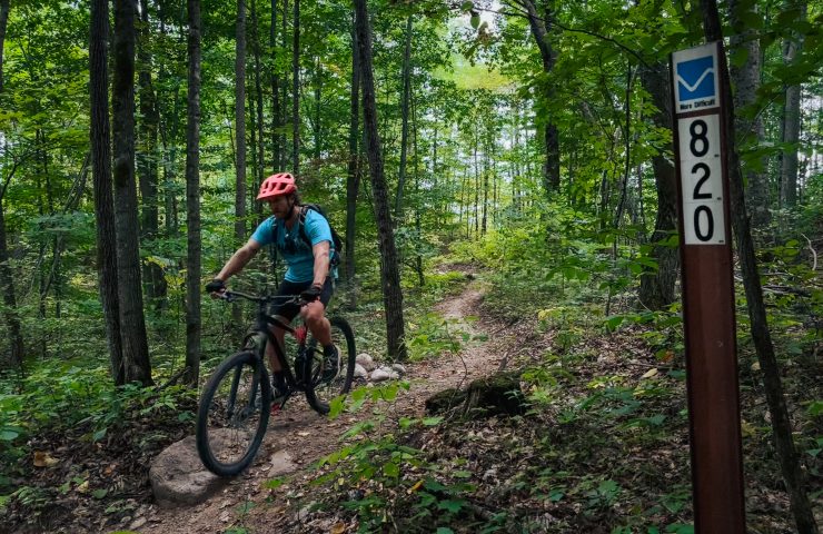 a mountain biker riding the trails at strong falls trails in wisconsin
